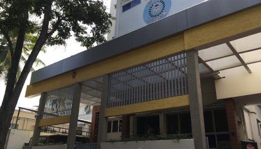 "Building of Sudarshan Vidya Mandir I.C.S.E. Academy with a well-designed facade and the school’s name displayed prominently."